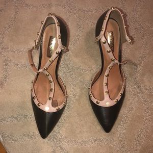 Black heels. Tan trim. Yellow gold grommets.